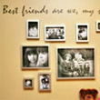 A wall decal about friendship with black and white pictures of friends in different sizes hanging on the wall.
