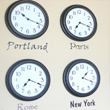 City names wall decal with timepiece on each name stating its different time zones - Portland , Paris, Rome, New York