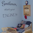 Wall lettering above the wooden baby boy's crib - Gentlemen Start your Engines