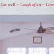 Wall Quotation on a drop ceiling in the entrance of a dining room .Eat Well - Love Often - Love
