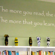 Wall quote above book shelf in a school library by Dr Suess - the more you read, the more you'll learn