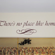 Wall quotes above the window with curtain and a lettering art just below the wall decal - There's no place like home