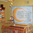 Wall decal with moon design on the side and a crib on the center in the baby's room